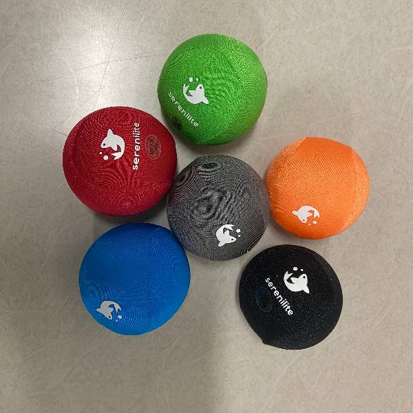 six stress balls in several colors